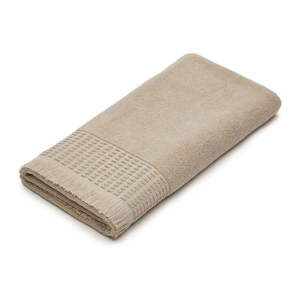 Béžový bavlnený uterák 70x140 cm Veta - Kave Home vyobraziť