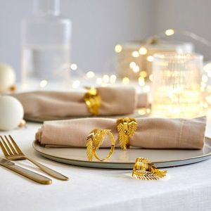 Súprava 4 krúžkov na obrúsky s motívom lístkov vyobraziť